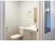 Bright bathroom featuring a gray vanity and modern fixtures, along with a toilet at 679 Winchester Ln, Norcross, GA 30071