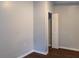 An empty bedroom has an open closet and neutral paint at 679 Winchester Ln, Norcross, GA 30071