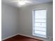 Bright bedroom featuring a ceiling fan and a large window for plenty of natural light at 679 Winchester Ln, Norcross, GA 30071