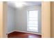 Empty bedroom with a window and neutral walls at 679 Winchester Ln, Norcross, GA 30071