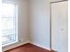 Inviting bedroom with a window, built-in radiator, and closet for added convenience at 679 Winchester Ln, Norcross, GA 30071