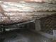 Insulated crawl space featuring exposed brick, concrete supports, and HVAC ductwork at 679 Winchester Ln, Norcross, GA 30071