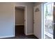 Entryway with front door and view of backyard, light walls and dark floors at 679 Winchester Ln, Norcross, GA 30071