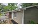 Home exterior featuring vinyl siding with manicured landscaping, offering great curb appeal at 679 Winchester Ln, Norcross, GA 30071
