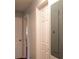 Hallway with dark wood floors and white doors at 679 Winchester Ln, Norcross, GA 30071