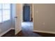 Hallway with wood-look floors with doorways and refrigerator visible in the background at 679 Winchester Ln, Norcross, GA 30071