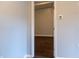 View of a hallway featuring wood-look flooring and neutral wall color at 679 Winchester Ln, Norcross, GA 30071