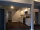 Open concept kitchen with white cabinets, stainless appliances, and tile backsplash at 679 Winchester Ln, Norcross, GA 30071