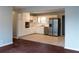 Open kitchen with white cabinets, stainless steel appliances, and tile flooring at 679 Winchester Ln, Norcross, GA 30071