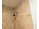 Close-up of a tiled shower wall showcasing the showerhead and modern design at 679 Winchester Ln, Norcross, GA 30071