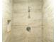 Close up of a shower with neutral tile and a built in shelf at 679 Winchester Ln, Norcross, GA 30071
