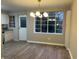 Bright dining room with wood floors, modern lighting, and a big window with natural light at 1148 Briarcliff Ne Rd # 1, Atlanta, GA 30306
