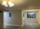 Open-concept dining area featuring modern lighting and views from a large window at 1148 Briarcliff Ne Rd # 1, Atlanta, GA 30306