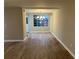 Open dining room with wood floors, modern lighting, and a big window with natural light at 1148 Briarcliff Ne Rd # 1, Atlanta, GA 30306