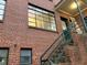 Exterior view of a red brick building with an exterior staircase at 1148 Briarcliff Ne Rd # 1, Atlanta, GA 30306