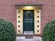 Apartment front door with the number 1148 with an interesting, symmetric facade and a small overhang for weather protection at 1148 Briarcliff Ne Rd # 1, Atlanta, GA 30306