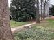 Beautiful front yard with mature trees, a sidewalk and a charming vintage lamppost at 1148 Briarcliff Ne Rd # 1, Atlanta, GA 30306