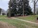 Charming front yard featuring mature trees, a sidewalk, and healthy green grass at 1148 Briarcliff Ne Rd # 1, Atlanta, GA 30306