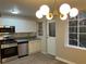 Modern kitchen with stainless steel appliances, granite countertops, and stylish white cabinetry at 1148 Briarcliff Ne Rd # 1, Atlanta, GA 30306