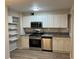 Updated kitchen featuring stainless steel appliances, granite countertops, and plenty of cabinet space at 1148 Briarcliff Ne Rd # 1, Atlanta, GA 30306