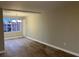 Bright living room with large multi-pane windows and laminate flooring at 1148 Briarcliff Ne Rd # 1, Atlanta, GA 30306