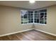 Bright living room featuring large corner windows offering neighborhood views at 1148 Briarcliff Ne Rd # 1, Atlanta, GA 30306