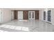 Basement living area showcasing marble floors and brick accent wall; great for entertaining at 2220 Emerald Dr, Jonesboro, GA 30236