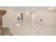 Finished basement with elegant marble floors and glass doors to the exterior at 2220 Emerald Dr, Jonesboro, GA 30236