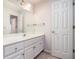 Bathroom features a white vanity with drawers and a mirror with lighting at 2220 Emerald Dr, Jonesboro, GA 30236