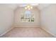 Inviting bedroom features a vaulted ceiling, fan, and large window with shutters at 2220 Emerald Dr, Jonesboro, GA 30236