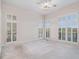 Sun-filled bedroom with large windows, carpet floors, and view of the outdoors at 2220 Emerald Dr, Jonesboro, GA 30236