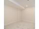 Neutral bedroom with white trim and marble-look tile flooring; perfect for relaxation at 2220 Emerald Dr, Jonesboro, GA 30236