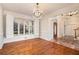 Bright dining room with hardwood floors, chandelier, and large windows with shutter at 2220 Emerald Dr, Jonesboro, GA 30236