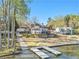 Exterior features a dock, lush landscaping, and an inviting entrance at 2220 Emerald Dr, Jonesboro, GA 30236