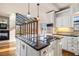 Bright kitchen boasts granite countertops and stainless steel appliances and a sunroom at 2220 Emerald Dr, Jonesboro, GA 30236