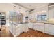 Bright kitchen with white cabinetry, an island, and stainless steel appliances at 2220 Emerald Dr, Jonesboro, GA 30236