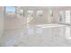Inviting living area boasting ample natural light, marble flooring, and scenic views at 2220 Emerald Dr, Jonesboro, GA 30236