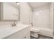 Updated bathroom featuring new vanity, modern fixtures, and tiled shower and tub at 3111 Fairington Dr, Lithonia, GA 30038