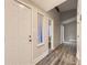 Inviting entryway boasting wood-look flooring, neutral paint, and vaulted ceiling at 3111 Fairington Dr, Lithonia, GA 30038