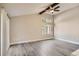 Bright living room with wood-look flooring, a ceiling fan, and exterior views at 3111 Fairington Dr, Lithonia, GA 30038