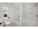 Bright bathroom with subway tile, glass shower door and window for great natural light at 360 Peyton Sw Rd, Atlanta, GA 30311