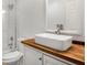 Bathroom featuring wood countertop vanity with a vessel sink and glass enclosed shower at 360 Peyton Sw Rd, Atlanta, GA 30311