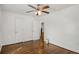 Bedroom featuring hardwood floors, ceiling fan, and white trim at 360 Peyton Sw Rd, Atlanta, GA 30311