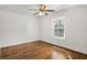 Bedroom with hardwood flooring, a ceiling fan, and a large window at 360 Peyton Sw Rd, Atlanta, GA 30311