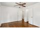 Bedroom with hardwood flooring and a ceiling fan, featuring two doorways at 360 Peyton Sw Rd, Atlanta, GA 30311