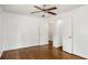 Bedroom featuring hardwood floors, ceiling fan, and two white doors at 360 Peyton Sw Rd, Atlanta, GA 30311
