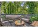 Relaxing deck with a hammock and seating surrounded by lush greenery, ideal for outdoor enjoyment at 360 Peyton Sw Rd, Atlanta, GA 30311