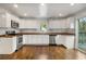 Bright, updated kitchen featuring stainless steel appliances, white cabinets, and open layout to the backyard at 360 Peyton Sw Rd, Atlanta, GA 30311