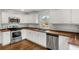 Updated kitchen with stainless steel appliances, butcher block countertops, and white subway tile backsplash at 360 Peyton Sw Rd, Atlanta, GA 30311