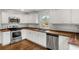 Modern kitchen features stainless steel appliances, butcher block countertops, and white cabinetry at 360 Peyton Sw Rd, Atlanta, GA 30311
